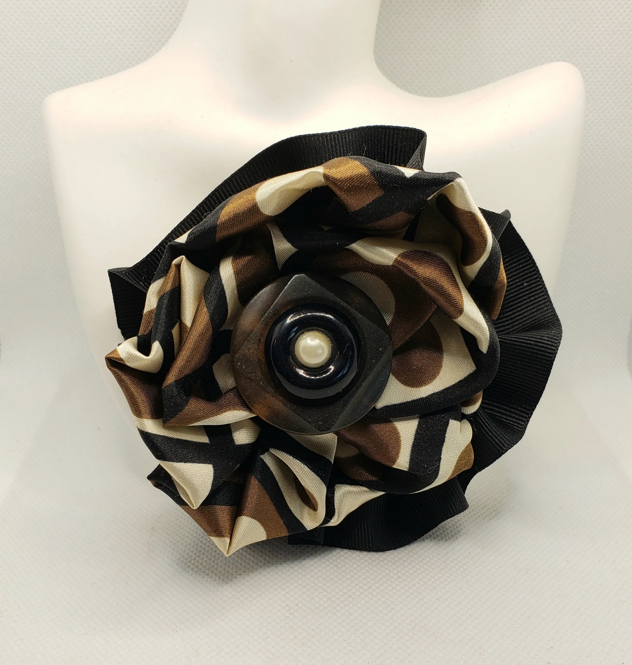Black and brown lapel pin