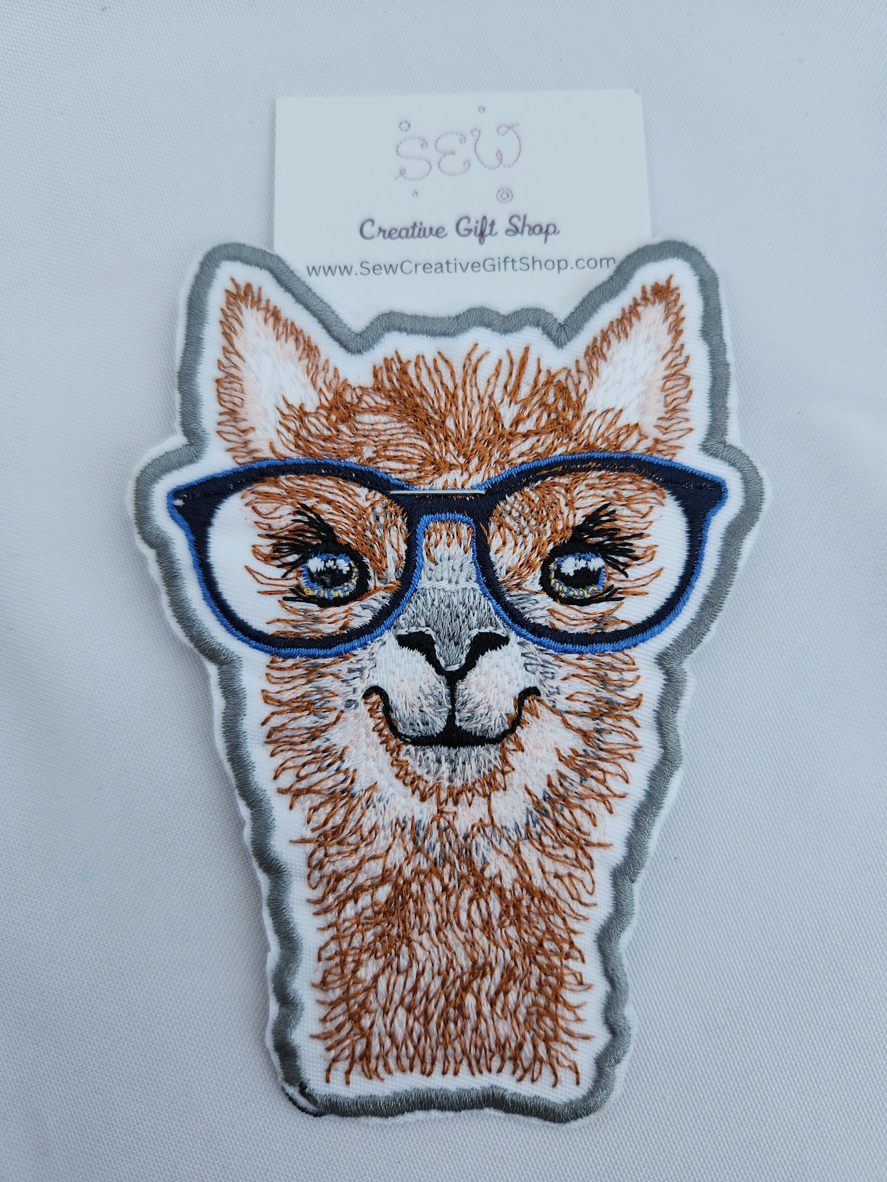 Llama with glasses embroidered iron-on patch